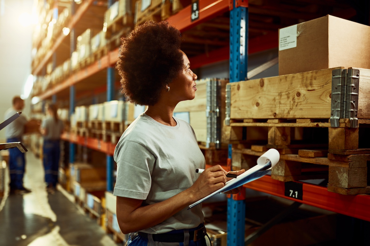 Worker in a warehouse checking inventory